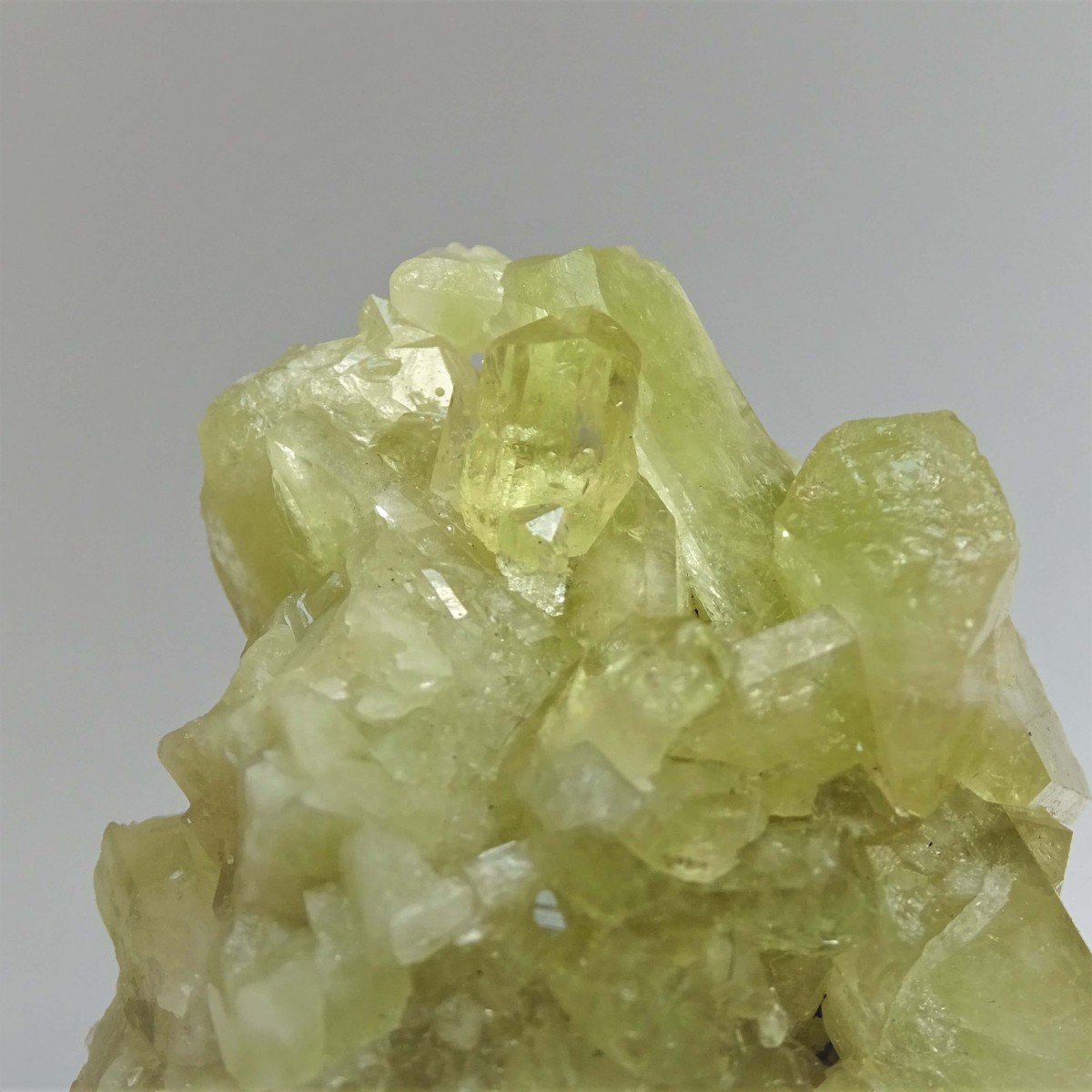 Brazilianite crystals in druse 71.7g, Brazil