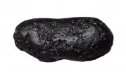 Tektite – a natural glassy material formed by an impact event